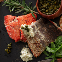Wild smoked sockeye salmon served with crackers, capers and lemon