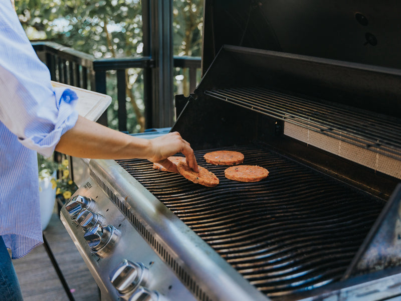 person grilling bacons